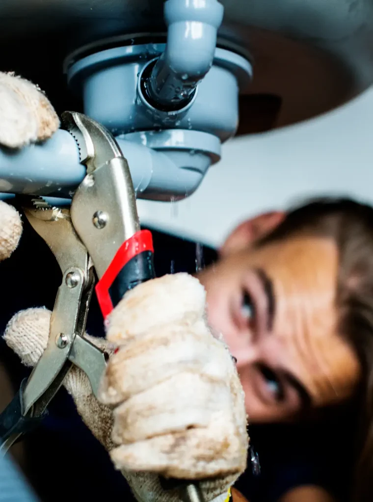 man-fixing-kitchen-sink